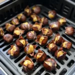 castane la air fryer coapte uniform, cu coajă crăpată și miez auriu
